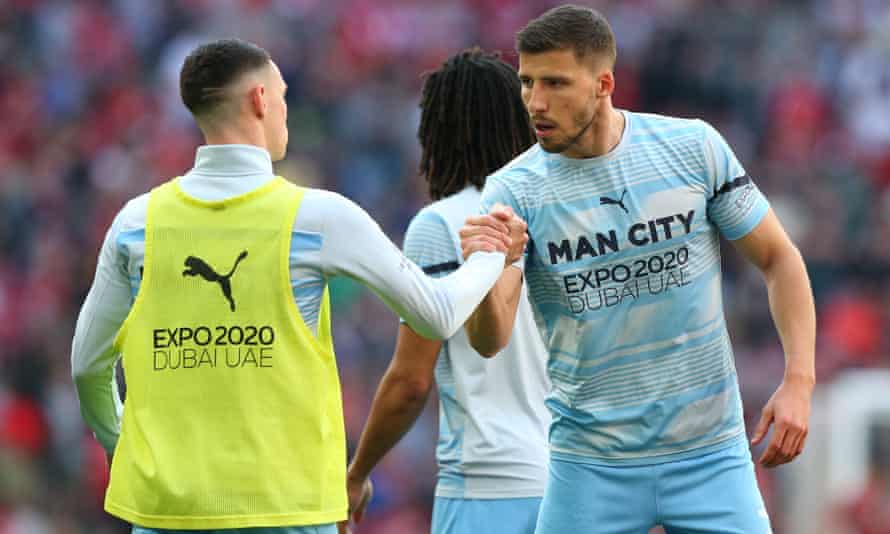 Manchester City’s Rúben Dias (right) is an unused substitute against Liverpool in the FA Cup