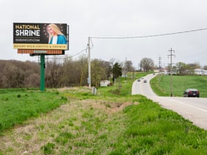 Along Highway 32, a digital billboard displays changing advertisements, such as for the National Shrine in Perryville, Missouri, shown here. According to its operator Robinson, this billboard in Ste. Genevieve averages around 25,340 travellers per week.