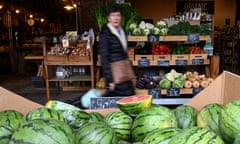 Members of the public shop for fresh produce at a market in Melbourne
