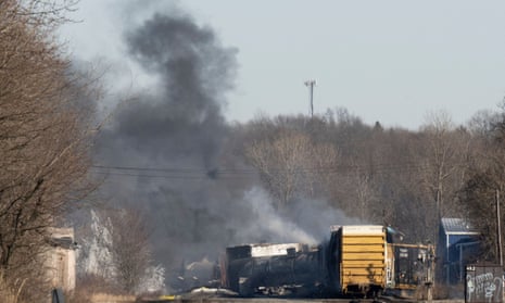 Smoke rises from the derailed cargo train in East Palestine, Ohio, on Saturday.