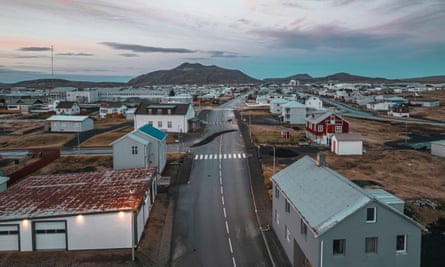 View down deserted street of Grindavík, 11 November, showing white, detached houses in low wintry lightThis image taken with a drone shows the town of Grindavik, Iceland, Thursday, Nov. 16, 2023. Residents of a fishing town in southwestern Iceland have left their homes after increasing concern about a potential volcanic eruption caused civil defense authorities to declare a state of emergency in the region. Iceland’s Meteorological Office says police decided to evacuate Grindavik after recent seismic activity in the area moved south toward the town. (AP Photo/Bjorn Steinbekk)