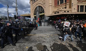 Protesters are pepper sprayed by police during an anti-lockdown protest in Melbourne