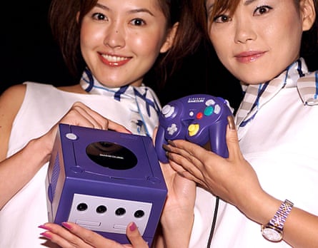 Nintendo employees and the GameCube in 2001.