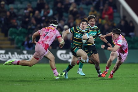 Anthony Belleau of Northampton Saints is tackled by Seb Driscoll of Harlequins