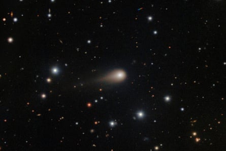 A comet streaking across a star field above the International Gemini Observatory on Cerro Pachon, near La Serena, Chile