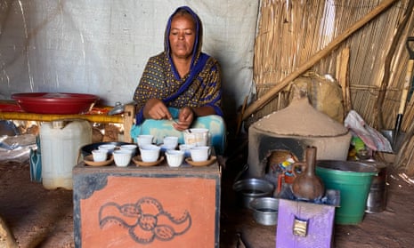 Lemlen Abraha, a Tigrayan refugee, prepares food at her home in a refugee camp in Sudan