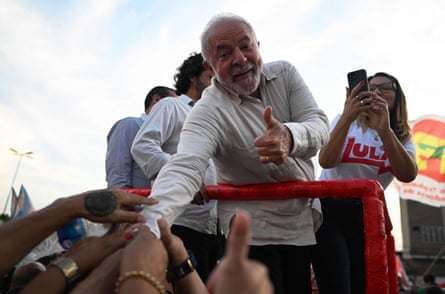 Former Brazilian president and left-wing Workers' Party presidential candidate Luiz Inacio Lula da Silva greets supporters during an election rally in Belford Roxo, Rio de Janeiro state.