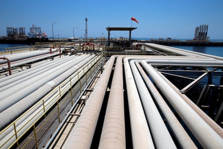 A series of pipes at a refinery and oil terminal in Jeddah, where an oil tanker is being loaded.