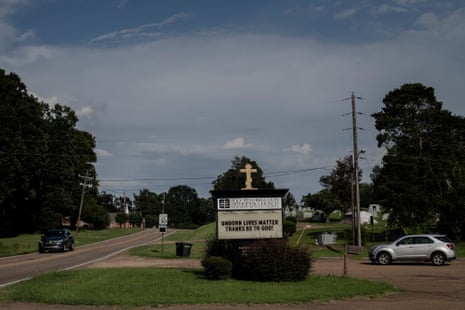 An anti-abortion sign reading “Unborn Lives Matter” in a direct reference to the “Black Lives Matter” slogan stands in front of a church