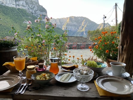 Breakfast with a view of mountains on the terrace of the Papaevangelou Hotel, Megalo Papingo, Greece.