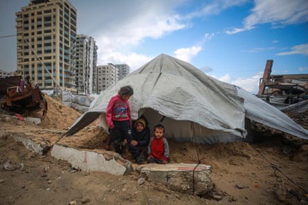 A family in a makeshift tent in Gaza City, Gaza, on 28 December.