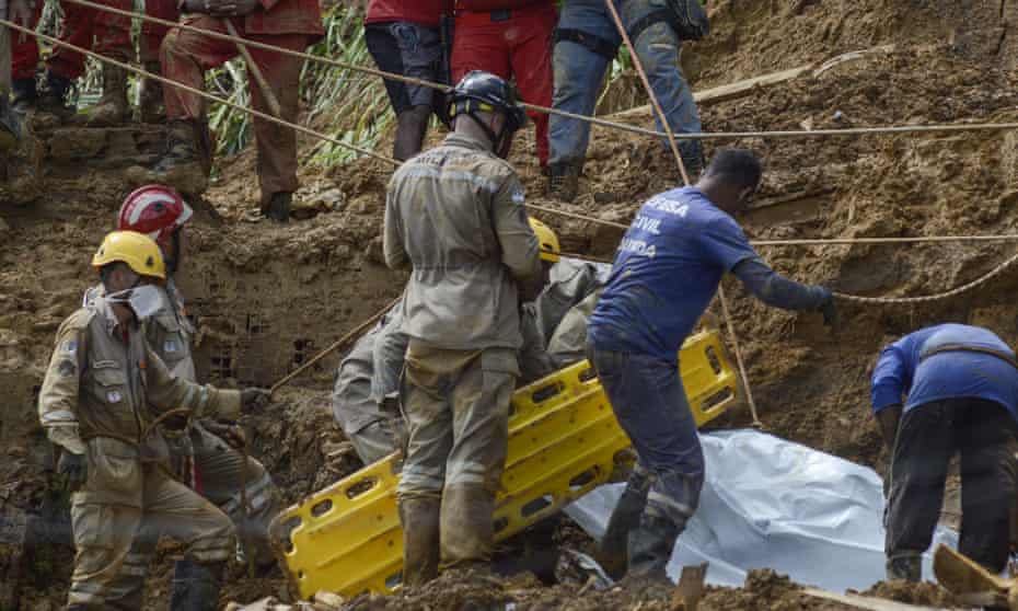 Firefighters working in the area of a landslide due to heavy rains in the Corrego do Jenipapo neighbourhood in Recife, Brazil.