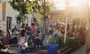 Parisians enjoy the sunshine at Les Grands Voisins.