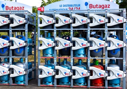 Self-service Butagaz liquefied petroleum gas bottles stored in metal cages