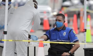 City of Miami police officer Anthony Reyes has blood drawn as he undergoes a COVID-19 antibody test at Hard Rock Stadium. (AP Photo/Lynne Sladky)
