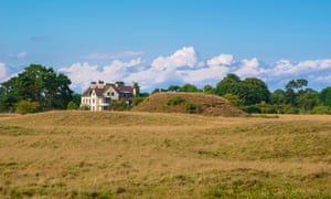 One of the burial mounds and Tranmer House, the home of Edith Pretty who instigated the Sutton Hoo digs in 1939.