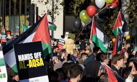 Flags and placards at the pro-Palestine march