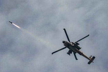 Israeli military helicopter launches rocket.