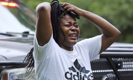 A woman screams as she arrives at Mount Tabor high school in Winston-Salem, North Carolina, 30 minutes after the call of shots fired at the school on Wednesday.