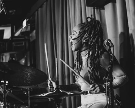 Romarna Campbell playing the drums