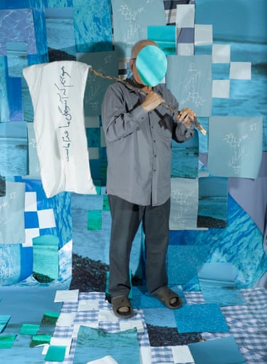 A man carrying a flag against a blue background