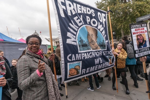 A banner commemorating Mikey Powell, at a 2018 march of remembrance for people killed in custody.