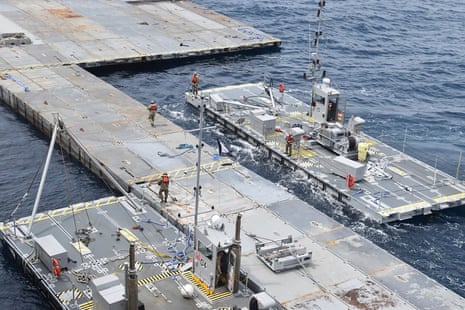 This undated photo released early Tuesday, 30 April by the US military's Central Command, shows construction of a floating pier in the Mediterranean Sea off the Gaza Strip.