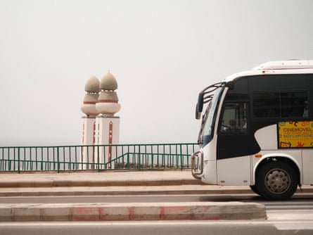 Cinemovel’s bus drives past the minarets of the Mosque of Divinity in Dakar, Senegal.