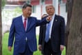 President Donald Trump talks with China’s President Xi Jinping.