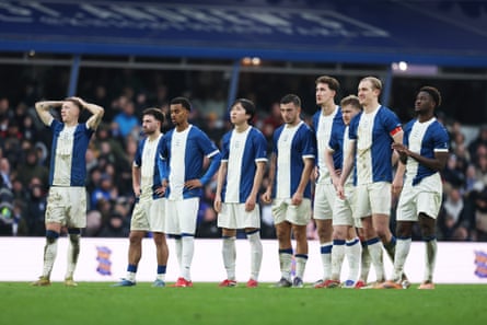 Birmingham’s players, in their retro shirts, react to their shootout defeat.