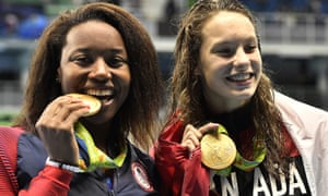 Simone Manuel, left, and Canada’s Penny Oleksiak shared gold in the 100 freestyle