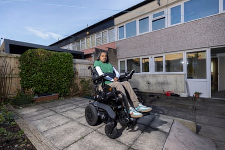 A woman pictured on the patio behind her house