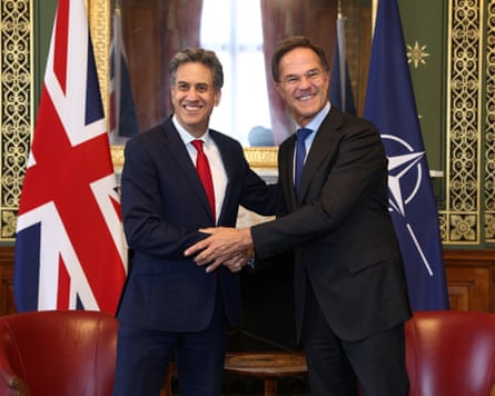 Mark Rutte shakes hands with Ed Miliband