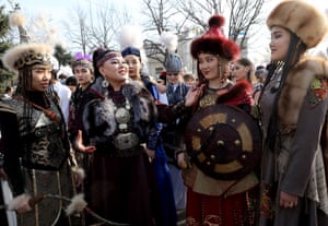 Young women in national costume celebrate Kalpak Day in Bishkek, Kyrgyzstan