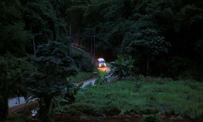An ambulance believed to be carrying one of rescued schoolboys leaves the Tham Luang cave complex.