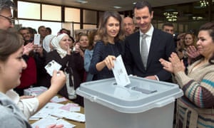 Asma al-Assad voting with husband Bashar at a polling station in Damascus in April 2016