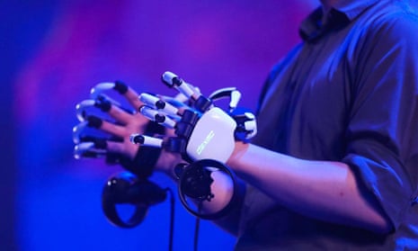 A person wearing robotic gloves with articulated finger joints