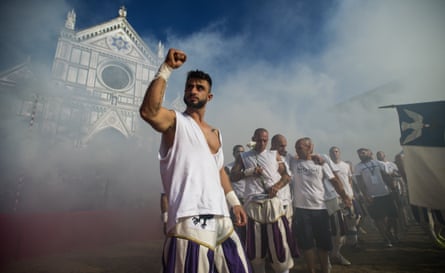 The white team of Santo Spirito enter the square for their semi-final.