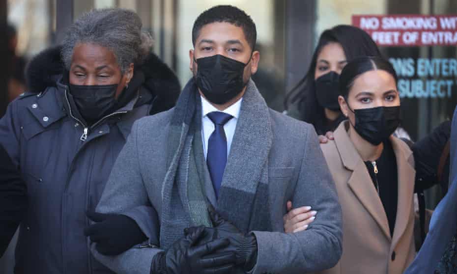 Former Empire actor Jussie Smollett leaves a courthouse in Chicago with his mother, Janet, left, and sister Jurnee, right.