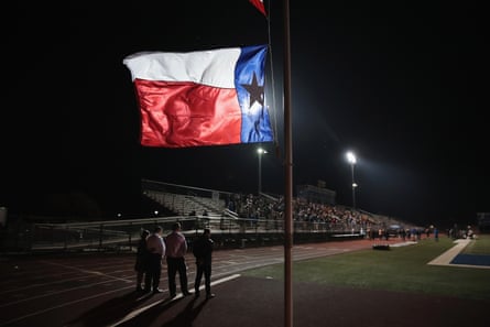 A Texas flag flies at half mast during a prayer services at the La Vernia High School Football stadium to grieve the 26 victims killed at the First Baptist Church of Sutherland Springs on November 7, 2017 in La Vernia, Texas.
