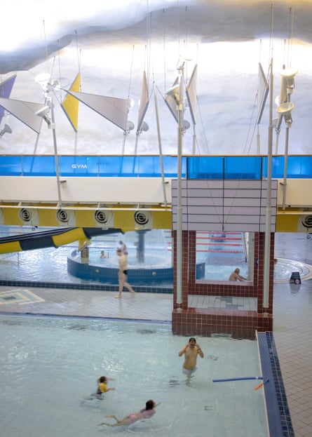 People swim in the pools of the Itäkeskus aquatic and multi-sports centre in a bunker in Helsinki.