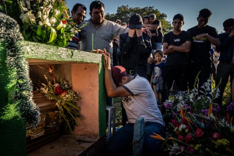 Relatives attend the funeral of Glendy Yesenia López, 20. She was killed by two gang members while she was driving her motorcycle taxi