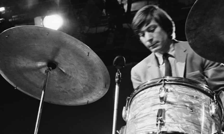 Charlie Watts in 1964. The crisp economy of his drumming, both swinging and muscular, was remarkable for its absence of frills, freeing the rest of the band to express themselves around it.