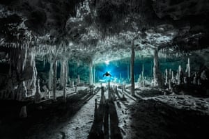 Speleothems cast long shadows at Cenote dos Pisos in Quintana Roo state, Mexico. Winner: Exploration Photographer of the Year