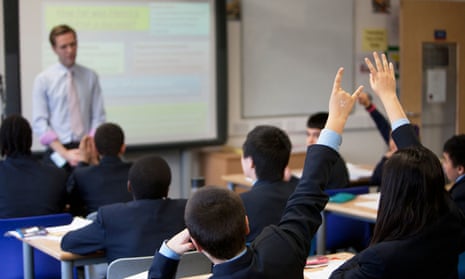 A teacher takes a class at Pimlico Academy in London