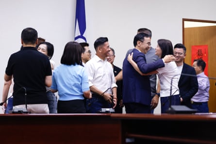 Kuomintang party members embracing