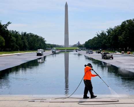 Repair work continues as the Lincoln Memorial Reflecting Pool is partially filled with water on Friday.