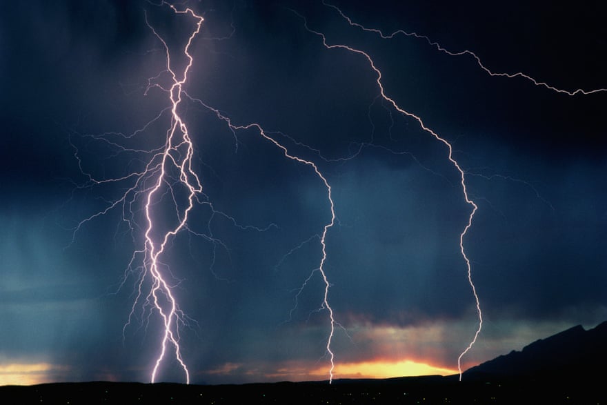 Lightning bolts on dark sky at dusk sunset Tucson, Arizona, USA.
