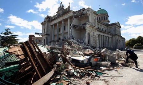 A rescue worker looks through the rubble of the Cathedral of Blessed Sacrament in Christchurch, New Zealand after the February 2011 earthquake