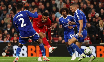 Cody Gakpo strikes through a crowd of players to equalise for Liverpool.